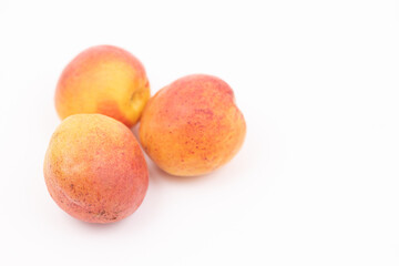 Fresh apricots isolated above white background with copy space