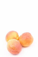 Fresh apricots isolated above white background with copy space