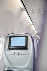 Crop image of airplane screen device for entertainment to serve passenger. Flying with airplane....