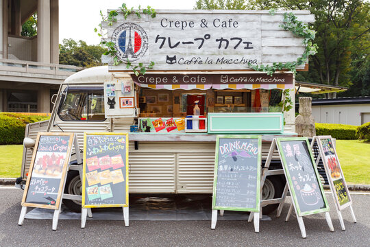 Tokyo, Japan - April 23, 2020 : small japanese business food truck selling sweet dessert crepe and coffee in the park at Tokyo festival market.
