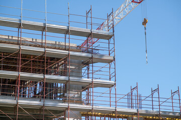 Architecture, construction of a building, the construction site grows with the development of the flat building by inserting new elements of the pontoon in the facade. superbonus