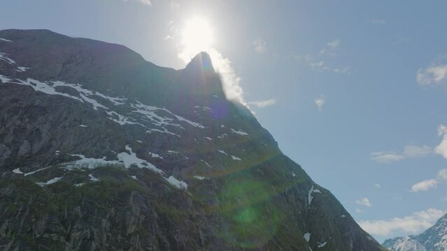 backlit mountain peak in Romsdal, Norway