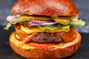 tasty burger with beef cutlet and vegetables
