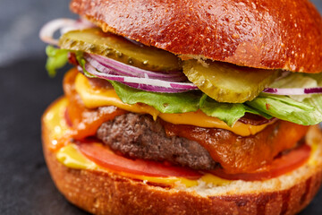 tasty burger with beef cutlet and vegetables