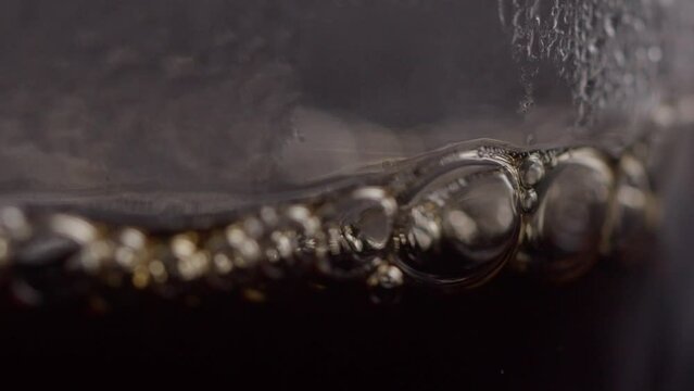 Liquid Coffee Pouring abd Coffee Bubbles