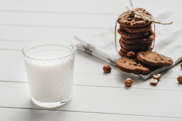 Homemade Cookies and Glass Filled with Milk on the White Table