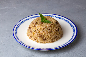 Traditional delicious Turkish foods; bulgur pilaf with green lentils (Turkish name; yesil mercimekli bulgur pilavi)