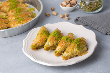 Turkish Dessert Sobiyet Baklava. Turkish pistachio baklava on a white background. Local name şöbiyet baklava