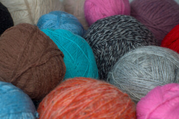 Fototapeta na wymiar colorful balls of yarn, crochet threads, selective focus