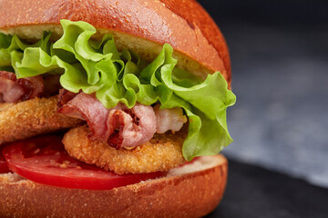 tasty burger with beef cutlet and vegetables