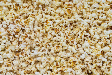 Close up of popcorn behind glass for sale at the international street food festival. Background...