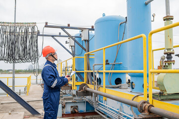 Water plant maintenance technicians, mechanical engineers check the control system at the water treatment plant.