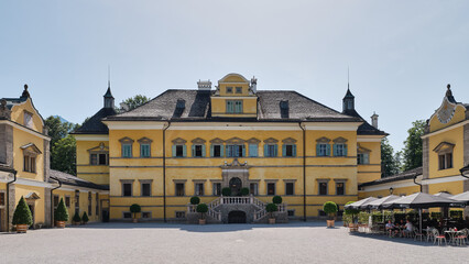Front outer wall facade of Hellbrunn Palace with windows, staircase and entrance, Salzburg, Austria