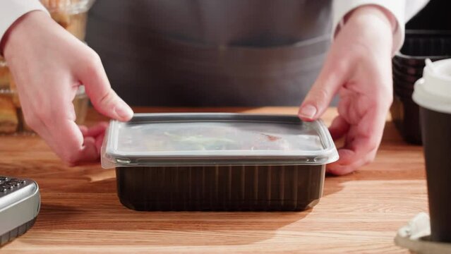 Food delivery service. Preparing take away containers with fresh lunch boxes meals. Healthy eating habits. Online contactless food shopping. Arrabian cuisine. 