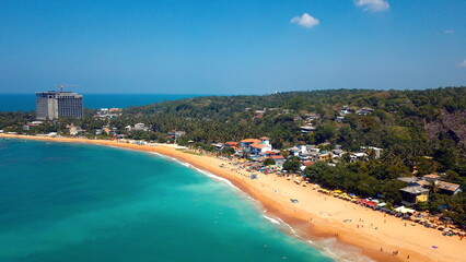 Beach coastline in Unawatuna, Sri Lanka. Popular destination for tourists visiting Sri Lanka. Situated close to Galle and Mirissa