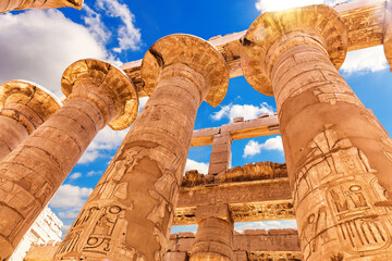 Ancient Columns with beautiful carvings, Karnak Temple, the Great Hypostyle Hall, Luxor, Egypt