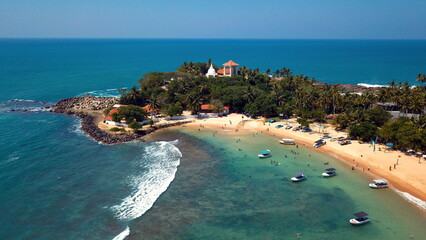 Beach coastline in Unawatuna, Sri Lanka. Popular destination for tourists visiting Sri Lanka....