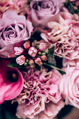 Hand tied exquisite bouquet features antiqua carnations, elegant Calla Lilies, Roses and fragrant Eucalyptus.