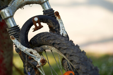 Close up of an old rusty bicycle. Brakes and tires are defective. MTB Two-wheeler is a sea find...