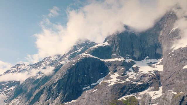 Troll wall covered in clouds. 