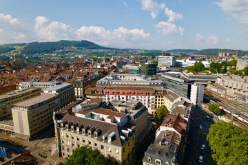 Fototapeta na wymiar Aerial view of City of Bern, capital of Switzerland, on a blue cloudy summer day. Photo taken June 16th, 2022, Bern, Switzerland.
