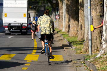 Cyclists on bicycle lane at City of Bern on a sunny summer morning. Photo taken June 16th, 2022, Bern, Switzerland.
