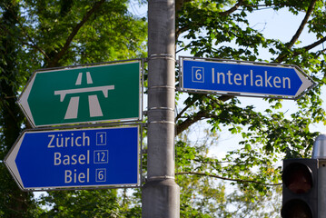 Fototapeta premium Direction signs at Lorraine Bridge at City of Bern, capital of Switzerland, on a sunny summer day. Photo taken June 16th, 2022, Bern, Switzerland.
