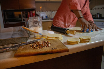 person kneading dough