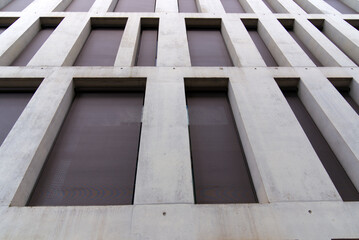 Close-up of modern concrete facade of office tower at City of Bern, capital of Switzerland, on a sunny summer day. Photo taken June 16th, 2022, Bern, Switzerland.