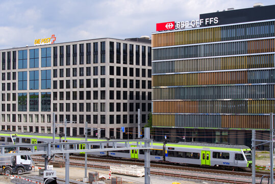 Modern office building of Swiss Railway Company SBB and Swiss Post at City of Bern on a blue cloudy summer day. Photo taken June 16th, 2022, Bern Wankdorf, Switzerland.