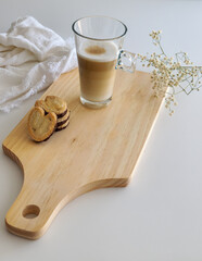 Latte macchiato coffee and palmiers biscuits with chocolate