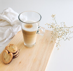 Latte macchiato coffee and palmiers biscuits with chocolate