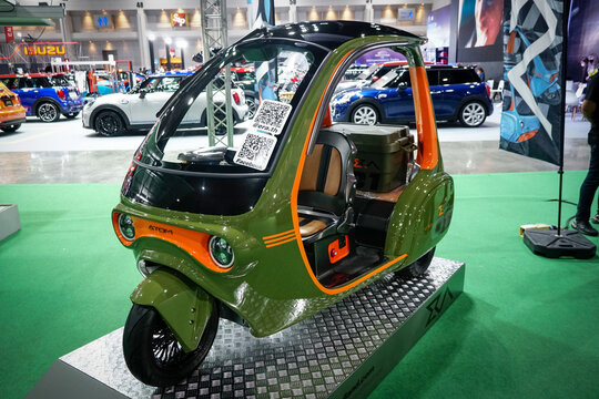 Bangkok, Thailand - 1 july 2022: Arom, a small electric tricycle at the bangkok auto salon 2022.                           
