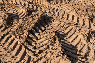 Wet soil ground, Car tire tracks footprint on construction site - Powered by Adobe