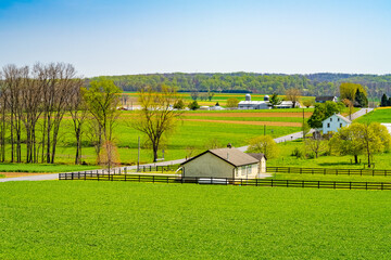 Amish country, farm, home and barn on field agriculture in Lancaster, Pennsylvania, PA US North...