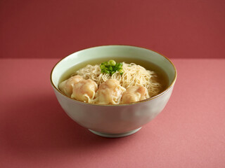 Signature Canton Jumbo Prawn Wanton Noodle with chopsticks served in a bowl isolated on mat side view on grey background