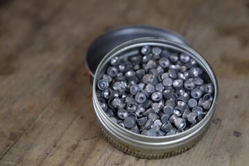Munition for airguns /lead pellets on a wooden prank 