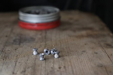 Munition for airguns / lead pellets on a wooden prank 