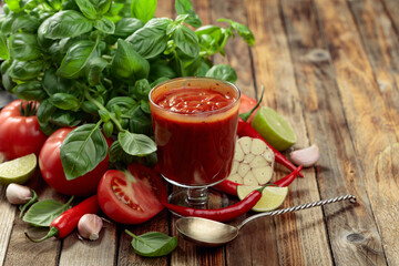 Homemade tomato sauce and ingredients.
