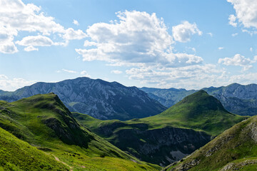 Zelengora mountains in Sutjeska National Park. Small pond in the valley surrounded by mountains....