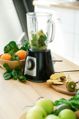 Fresh juicy ingredients in blender for making smoothie.