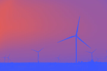 Ecological windmills produce energy standing on large field. Windmills in neon colors.