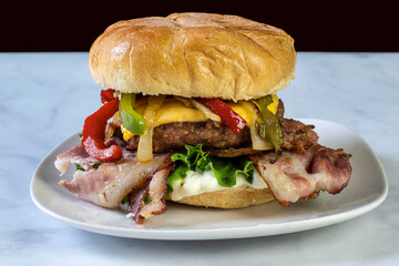 bacon cheese burger  top with onions and peppers