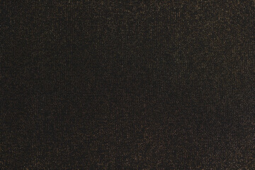 Shiny black background. Shimmering golden glitter closeup