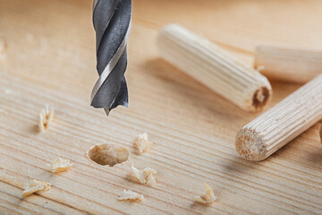 metal drill bit make holes in wooden oaks plank