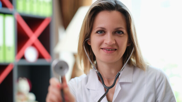 Portrait of a beautiful young doctor is holding stethoscope