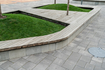 Walkway with curve and seating with tiles in different colors