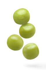 Flying delicious green peas, isolated on white background