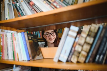 Portrait of a student girl studying at library