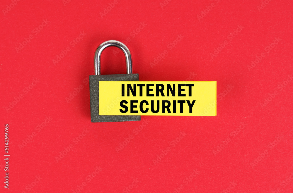 Poster on the red surface there is a lock with a sticker with the inscription - internet security